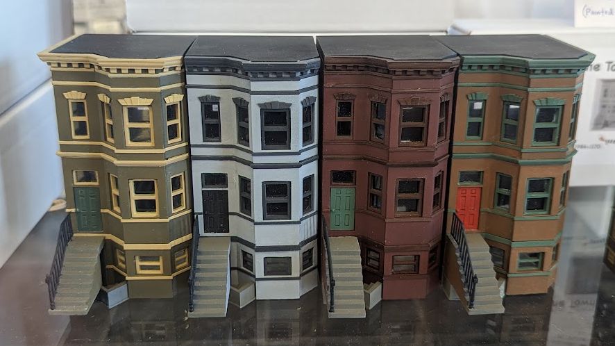 A set of 2 End Brownstone style townhouses.